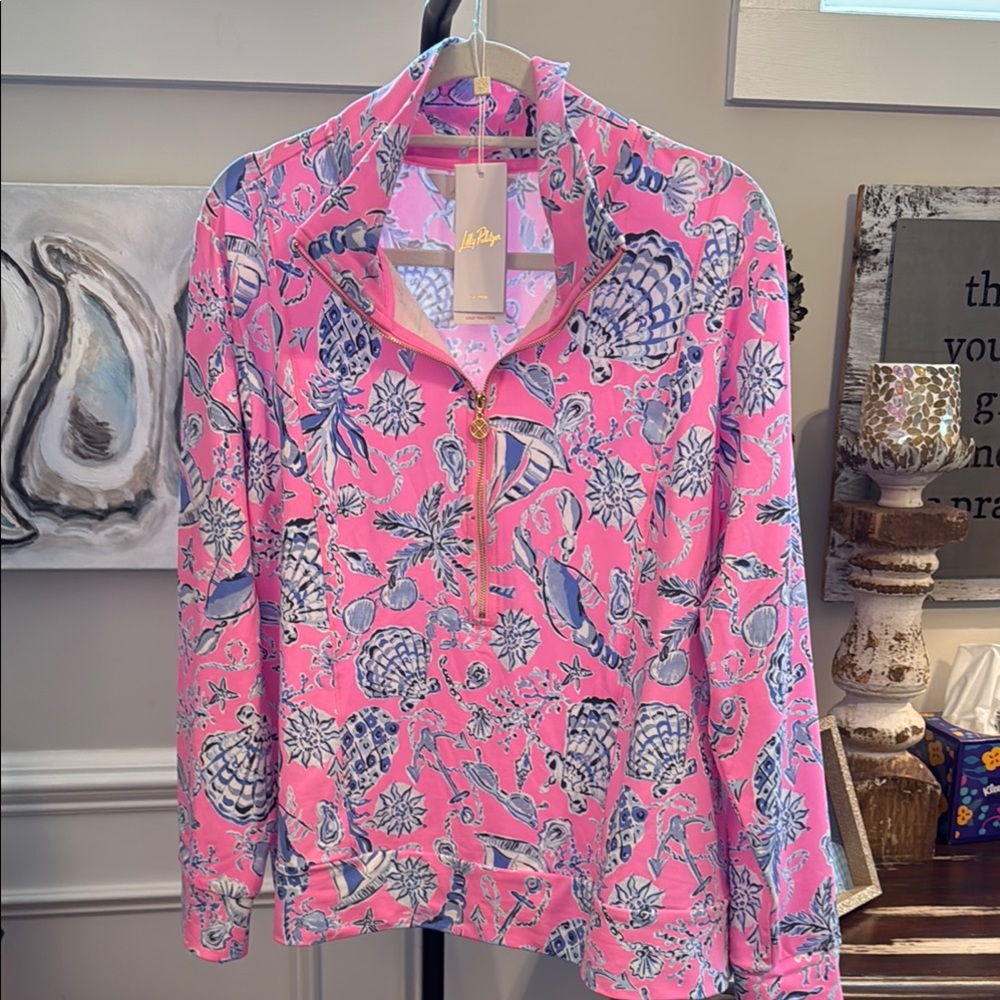 Lilly Pulitzer Vibrant Pink and Blue Eleni UPF 50+ half zip pullover.